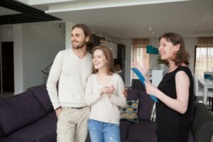 estate agent showing home to couple